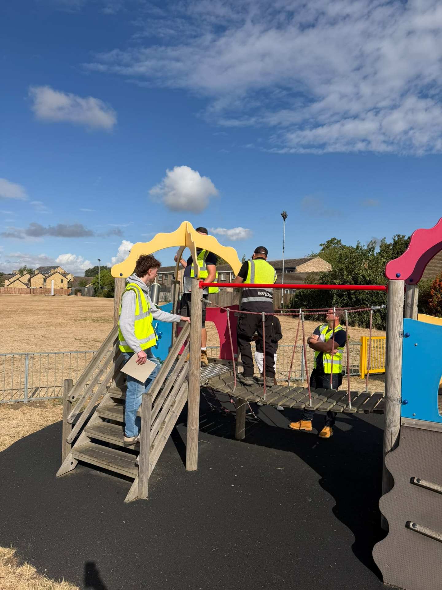 Setter Play team inspecting playground equipment